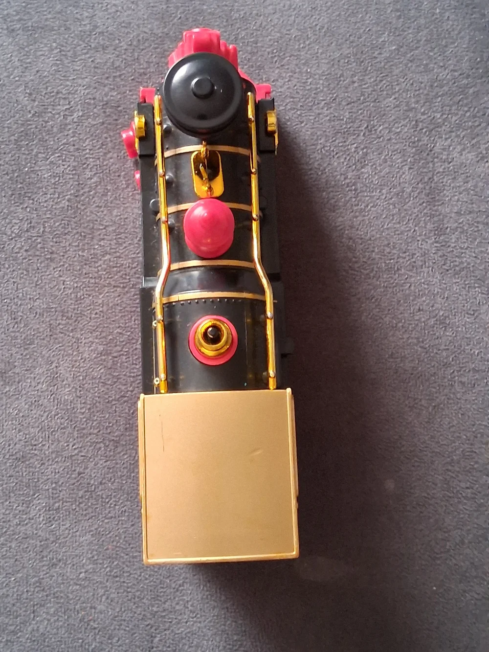 Vintage Style Black and Gold Toy Train with Red Accents